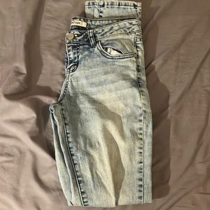 Refuge blue jeans with holes in the knees